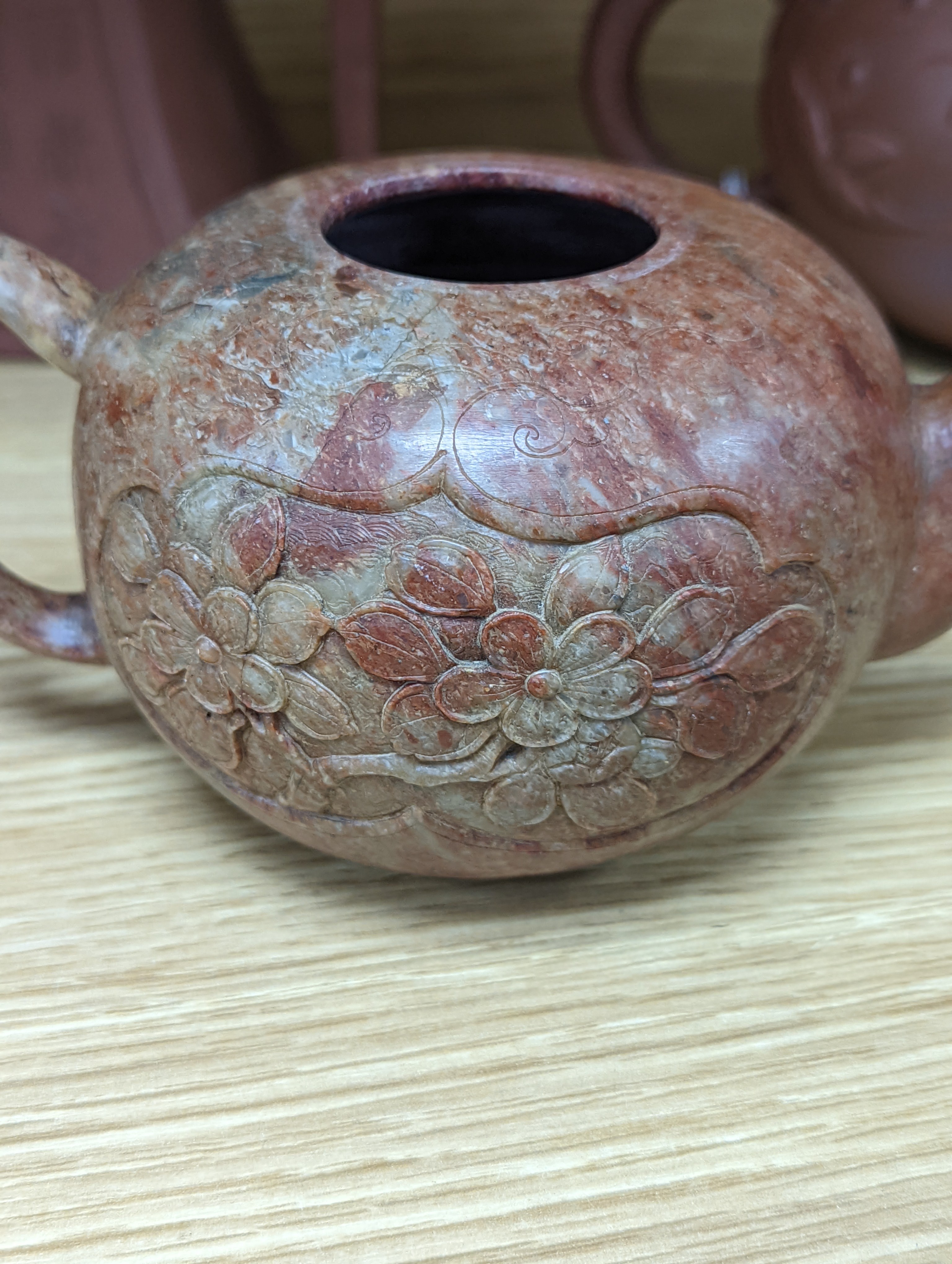 Three Chinese Yixing teapots and a carved soapstone teapot tallest 12cm